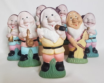 A cheerful troupe of 7 vintage clay musician elves painted in pastel colors
