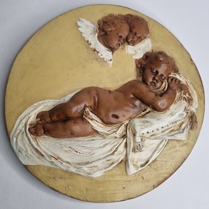 Embossed sleeping cherub, wall decoration, - Terracotta