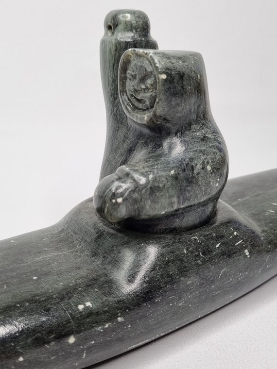 Sculpture of an Inuit Hunter in a Kayak, Carved and Signed