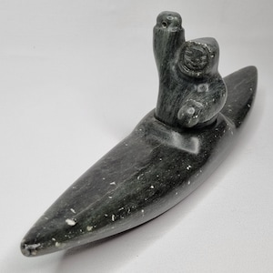 Sculpture of an Inuit Hunter in a Kayak, Carved and Signed by