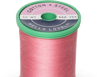 May include: A spool of pink cotton thread with a green label that reads "Cotton + Steel 50 WT 660 YDS Hello Lovely!"