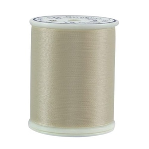 May include: A spool of beige thread with a white label that reads "Sulky 40 wt. 100% Cotton Embroidery Thread".