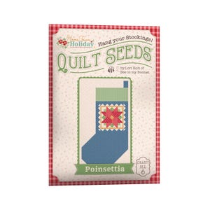 May include: A package featuring a Christmas stocking quilt pattern. The design includes a blue stocking with a poinsettia motif, green and red accents, and the text "Poinsettia". The package has a red and white checkered border and the text "Quilt Seeds".