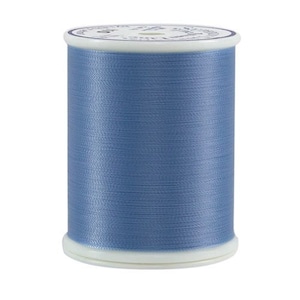 May include: A spool of light blue thread.