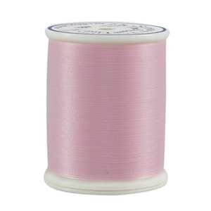 May include: A spool of pale pink thread with a white label that reads "100% Cotton Embroidery Floss".