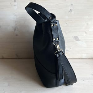 Oversized Black Leather Hobo Bag: side of the bag, details