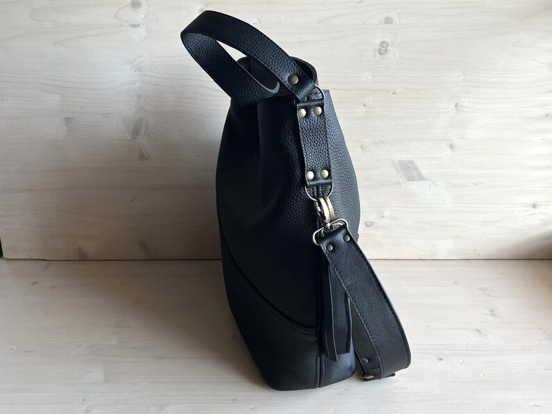 Oversized Black Leather Hobo Bag: side of the bag, details