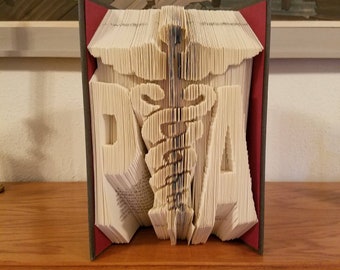 Regalo de graduación de Pensilvania, libro artesanal, diseño de caduceo.
