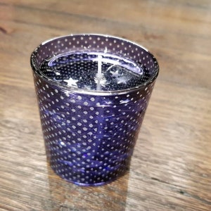 Lavender scented candle in a purple glass