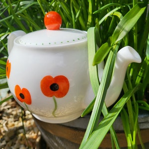 Hand painted two cup teapot with a poppy design