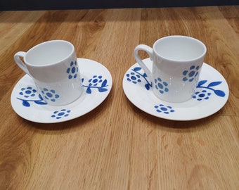 Hand painted expresso cup and saucer with a pearlescent floral design