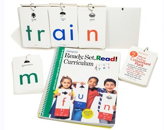May include: A set of colourful alphabet flashcards with pictures of objects and the words "Ready, Set, Read!" Curriculum written on a book. The flashcards are designed to help children learn to read and spell.