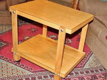 Table on wheels with two shelves