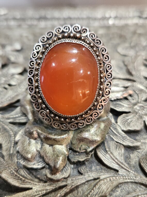 Antique oval orange stone ring set in silver (Carn