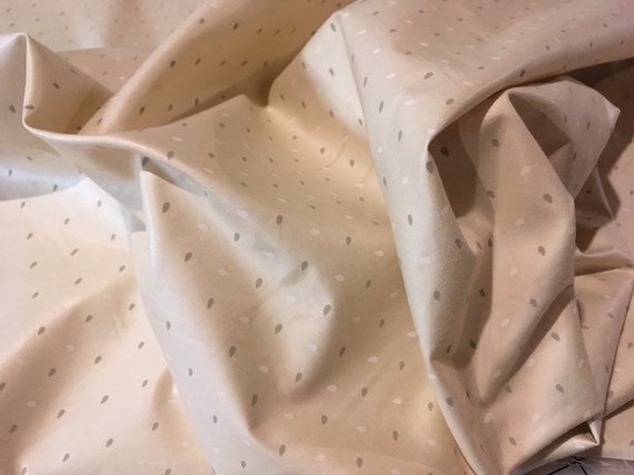 Vintage – taupe and white 1/8" teardrops on light tan medium weight medium sheen cotton