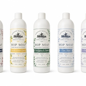 May include: Five white plastic bottles of Pleasant Run Farms Mop Soap floor wash concentrate, each 16 oz, featuring a windmill logo, scent names like Honeysuckle Lane and Eucalyptus & Steam, and instructions for use on sealed wood, tile, and vinyl flooring.
