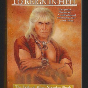 May include: A book cover for "Star Trek: To Reign in Hell" featuring a portrait of a man with long, white hair and a stern expression. The cover has text that reads "The Exile of Khan Noonien Singh" and "Greg Cox."