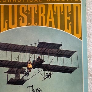 Puede incluir: Una portada vintage de la revista Aeronautical Gazette Illustrated que muestra un biplano en vuelo con el texto "Those Magnificent Men in their Flying Machines" y "Special Souvenir Edition 1910".