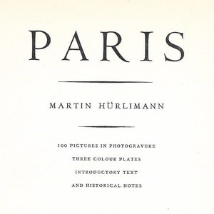 May include: Book cover with the title "PARIS" by Martin Hürlimann. The cover features a black and white illustration of a decorative design with the letters "T&H" inside.