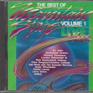 May include: A green and purple CD case with the text "The Best of Mountain Stage Volume 1 Live" and a list of artists including Dr. John, Buckwheat Zydeco, Richard Thompson, Loudon Wainwright III, Rick Danko/Garth Hudson, Clive Gregson/Christine Collister, Dan Hicks and The Acoustic Warriors, Jesse Winchester, Daniel Lanois, Larry Groce, and NRBQ.