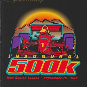 May include: A black and gold program cover for the inaugural Las Vegas 500k Indy Racing League race, held on September 15, 1986. The cover features a red race car with a yellow driver's helmet against a sunset background. The text "THE LEGEND BEGINS" is printed in gold at the bottom.