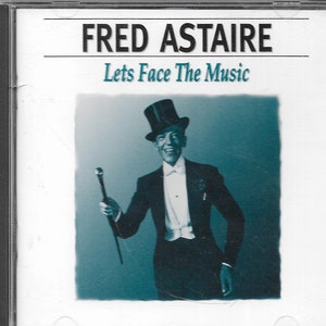 May include: A vintage CD case featuring a black and white photo of Fred Astaire in a tuxedo and top hat. The text on the case reads "FRED ASTAIRE Lets Face The Music".