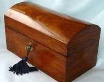 May include: A wooden box with a curved lid and a brass lock. The box has a dark wood finish and a blue tassel.