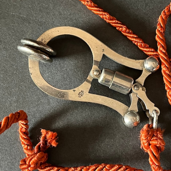 Victorian Edwardian Skirt Lifter with Burnt Orange Silk Cord, Stamped, Pinch Movement Clamp, Excellent Condition