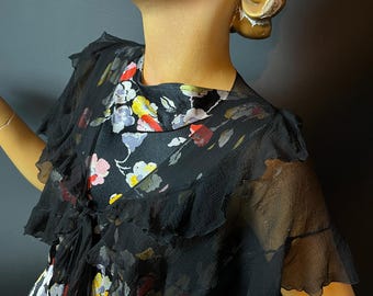 Capa corta de gasa negra transparente con volantes y lazos largos, estilo años 30, talla única.
