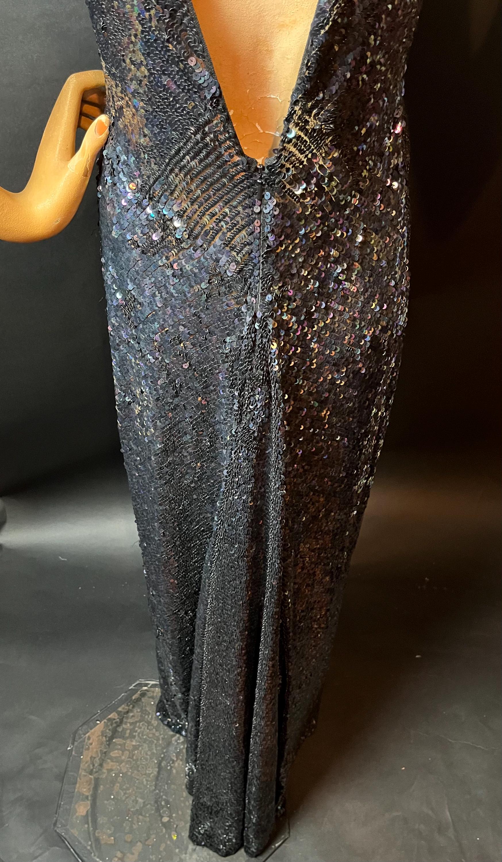 kate moss sequin dress Kate Moss is pictured wearing the iconic vibrant yellow sequin gown designed by Chanel for their 1999 couture runway show