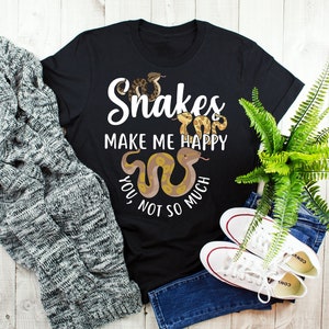 May include: Black t-shirt with a graphic of snakes and the text "Snakes make me happy, you not so much".