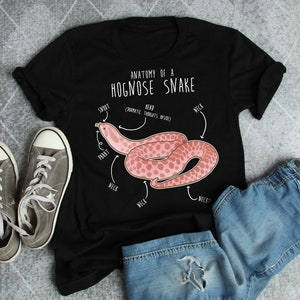 May include: A black t-shirt with a pink hognose snake illustration and the text "Anatomy of a Hognose Snake" with anatomical labels for the snake's body parts.