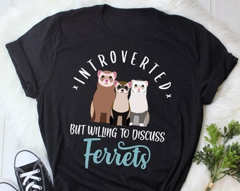 May include: Black t-shirt with a graphic of three ferrets and the text "Introverted but willing to discuss Ferrets".