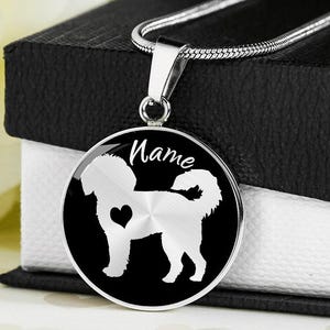 May include: A set of three ceramic mugs with a speckled, matte finish. Each mug features a different color: light blue, cream, and gray. The mugs have a simple, modern design and a comfortable handle.