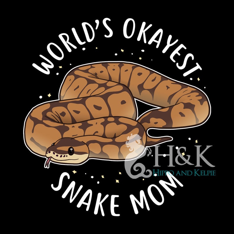 May include: A black and white graphic design with a brown and white snake curled up. The text "World's Okayest Snake Mom" is written in a white circle around the snake. The text "H&K Hippo and Kelpie" is written in white below the snake.