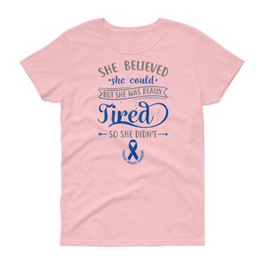 May include: Pink women's t-shirt with a blue ribbon and the text "SHE BELIEVED *she could* BUT SHE WAS REALLY Tired SO SHE DIDN'T&rarr; CHE FATIGUE SYNDROME"