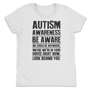 a white t - shirt with the words autism awareness be aware