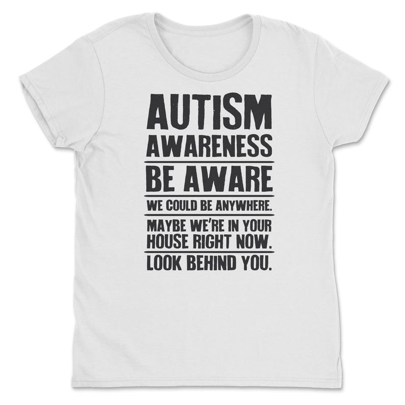 a white t - shirt with the words autism awareness be aware