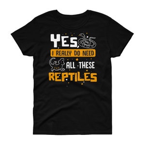 May include: Black t-shirt with a white graphic that says "Yes, I really do need all these reptiles". The graphic includes a snake and a lizard.