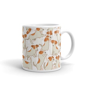 May include: White ceramic mug with a pattern of brown and white Jack Russell terriers. The dogs are in various poses, including sitting, standing, and jumping.