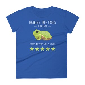 May include: A blue women's t-shirt with a green tree frog illustration and the text "Barking Tree Frogs - A Review -" and "Frogs are very nice 5 stars" with five yellow stars.