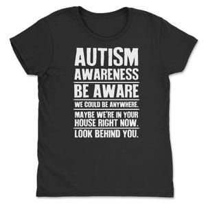 a black t - shirt with the words autism on it