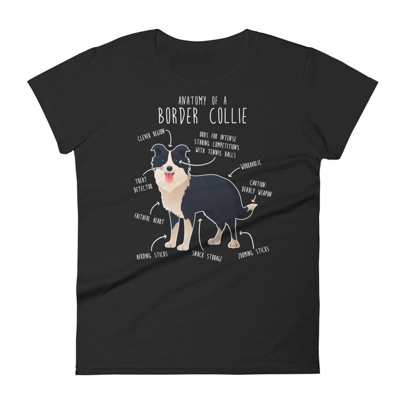May include: A black t-shirt featuring a white graphic of a border collie dog. The graphic includes text that says "Anatomy of a Border Collie" and labels different parts of the dog's body with humorous descriptions.