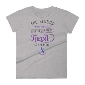 May include: Gray women's t-shirt with a purple and blue ribbon and the text "SHE BELIEVED she could BUT SHE WAS REALLY Tired SO SHE DIDN'T".