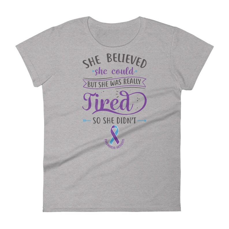 May include: Gray women's t-shirt with a purple and blue ribbon and the text "SHE BELIEVED she could BUT SHE WAS REALLY Tired SO SHE DIDN'T".