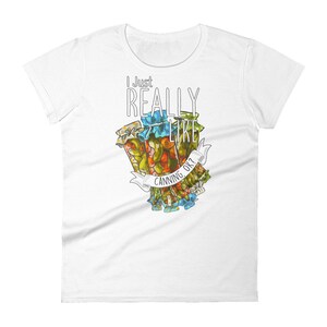 May include: White t-shirt with a graphic of jars of pickled vegetables and the text "I Just Really Like Canning, Ok?"