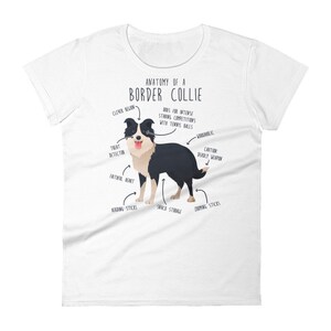 May include: White t-shirt featuring a black and white illustration of a Border Collie dog. The illustration is labelled with humorous anatomical features, such as "Treat Detector", "Snack Storage", and "Deadly Weapon". The text "Anatomy of a Border Collie" is at the top of the illustration.