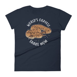 May include: A navy blue women's t-shirt with a white graphic of a snake and the text "World's Okayest Snake Mom".