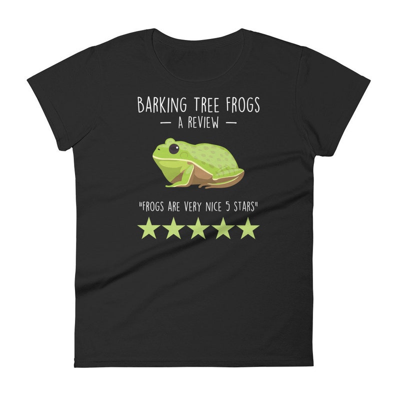 May include: Black women's t-shirt with a white graphic of a green tree frog. The text "Barking Tree Frogs - A Review -" is above the frog and the text "Frogs are very nice 5 stars" is below the frog. There are five white stars below the text.