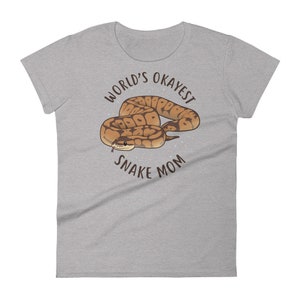 May include: A gray t-shirt with the text "World's Okayest Snake Mom" and a cartoon image of a brown and tan snake.